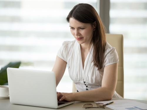 Woman typing on computer